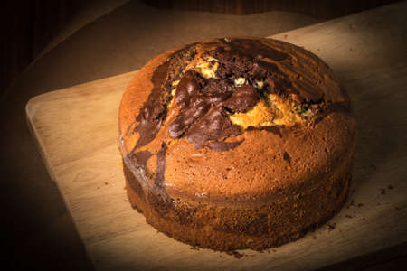 Homemade chocolate cake Zebra on the wooden table with a dark background. Delicious zebra marble cake.の写真素材