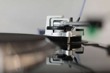 Vinyl record player. Details of the turntable player. Musical equipment with shallow depth of field.