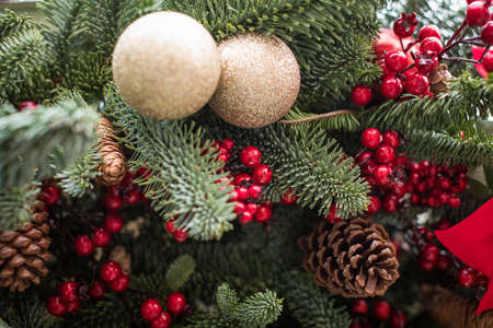 Decorated Christmas tree. Bright decorations for the New Year. Christmas decoration. Gold balls, red...