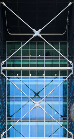 Metal construction of a modern building. Architectural details of a modern high-rise building. Metal parts of high-tech building.の写真素材