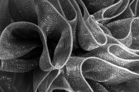 Macro photo of a Christmas chiffon bow. Ribbon fabric close up. Meshの写真素材