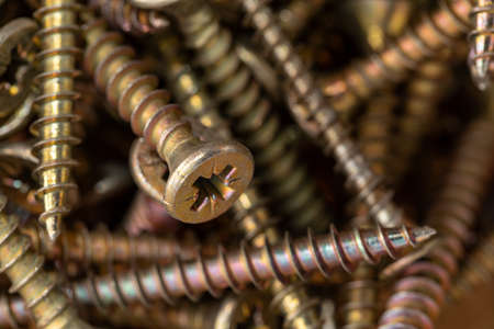 Macro photo of screws. Set of screws. Construction abstraction. Industrial background. Screws macro photo, screw background, steel screw, screw macro.の写真素材