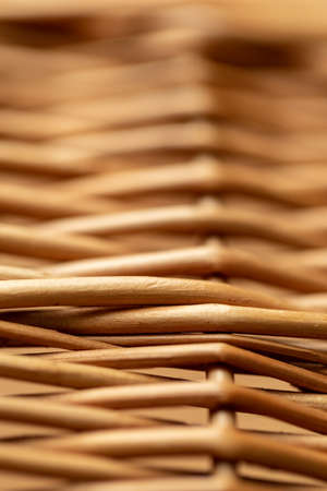 Wicker basket. Wooden basket. Rattan basket. Detail of a rattan basket. Wicker surface. Harvest and countryside background.の写真素材