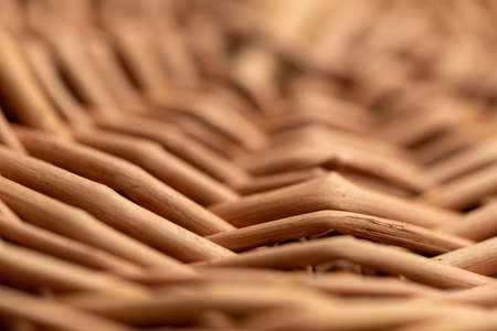 Wicker basket. Wooden basket. Rattan basket. Detail of a rattan basket. Wicker surface. Harvest and countryside background.の写真素材