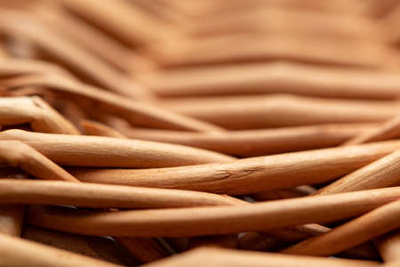 Wicker basket. Wooden basket. Rattan basket. Detail of a rattan basket. Wicker surface. Harvest and countryside background.の写真素材