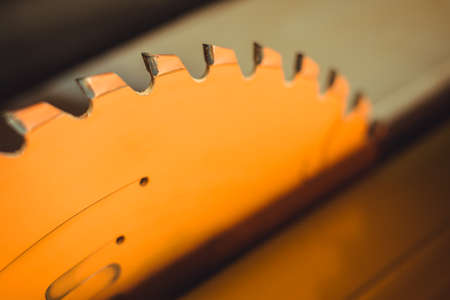 Circular saw. Carpentry. Electric saw table tool for woodwork. Orange circular saw. Woodworking...