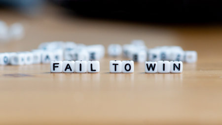 Fail to win slogan in white block bead letters. Motivation inspiration cheer up conceptの写真素材