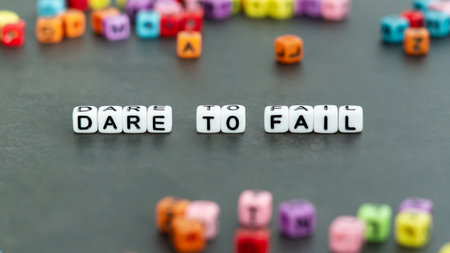 Dare to fail slogan in white block bead letters. Motivation inspiration cheer up conceptの写真素材