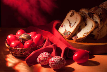 handmade Romanian wax decorated Easter eggs and traditional cake compositionの写真素材