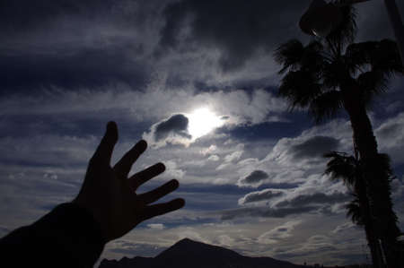Raising hand at the sky.の写真素材