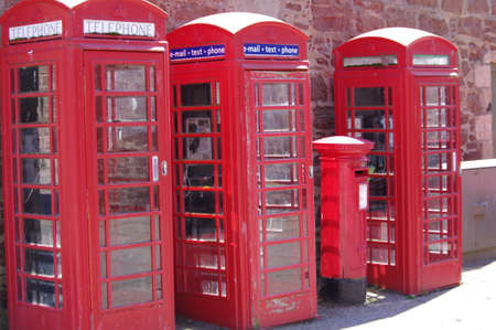 Vintage look Traditional red telephone box in Charleston, Inverness (Scotland)の写真素材