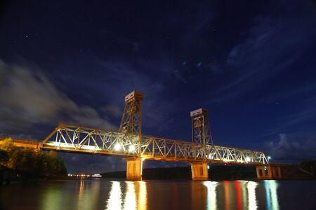 Leningrad region-August 14, 2014. Railway bridge across the river in the Leningrad region.のeditorial素材