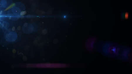Real Lens Flare Shot in Studio over Black Background. Easy to add as Overlay or Screen Filter Photosの写真素材