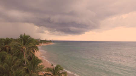 Sea shore in cloudy weather above