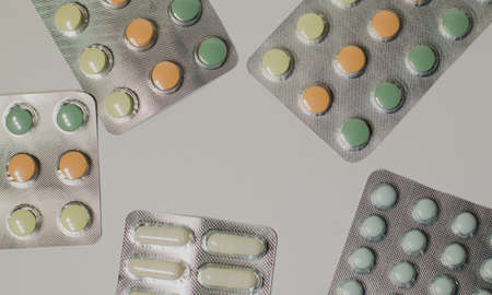 Medicines on a gray background of a different color