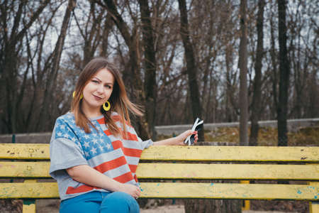 A girl hippy on the river bank posing and smilingの写真素材