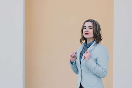 Portrait of a happy enamored girl in anticipation of a beloved man in the parkの写真素材