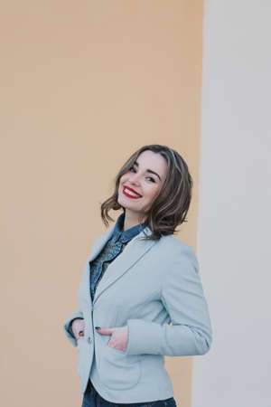 Portrait of a happy enamored girl in anticipation of a beloved man in the parkの写真素材