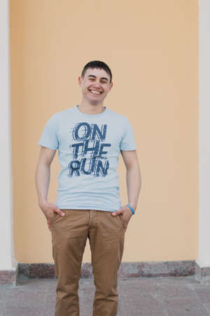 Portrait of a happy loving man waiting for his girlfriend in the parkの写真素材