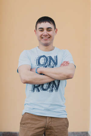 Portrait of a happy loving man waiting for his girlfriend in the parkの写真素材