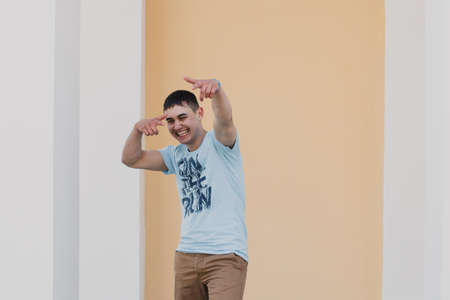 Portrait of a happy loving man waiting for his girlfriend in the parkの写真素材