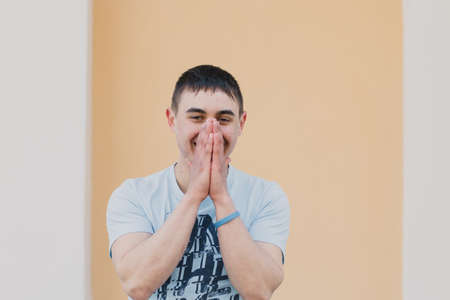 Portrait of a happy loving man waiting for his girlfriend in the park