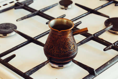 Turka with coffee on the gas stove.の写真素材