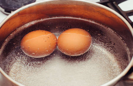 Eggs are cooked on the gas stove.の写真素材