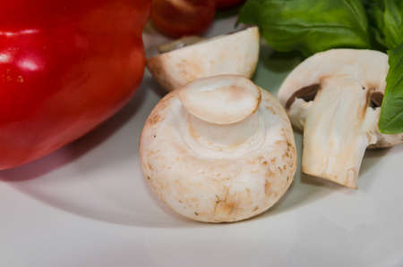 Parsley, lemon, pepper champignons on a plateの写真素材