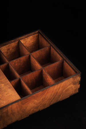 Wooden box on a black background, wooden texture