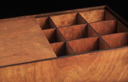 Wooden box on a black background, wooden texture