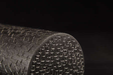 Wooden product made of wood on a black backgroundの写真素材