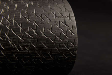 Wooden product made of wood on a black backgroundの写真素材