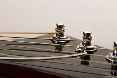 Old electric guitar on a white background