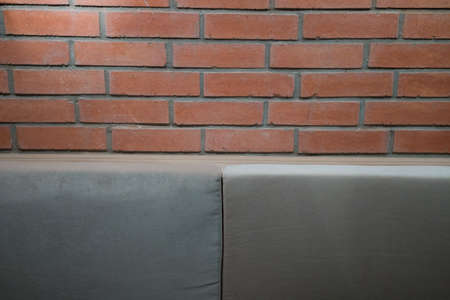 Brick background with soft lighting and furniture details