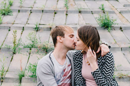Two lovers walk around the park, kiss and hug, a love story.の写真素材