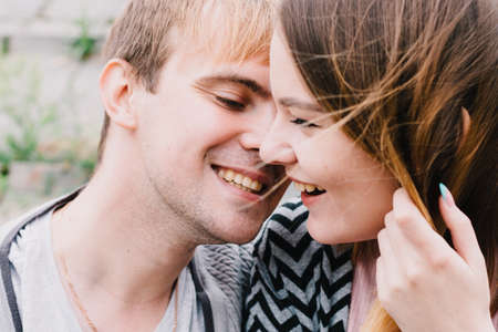 Two lovers walk around the park, kiss and hug, a love story.の写真素材