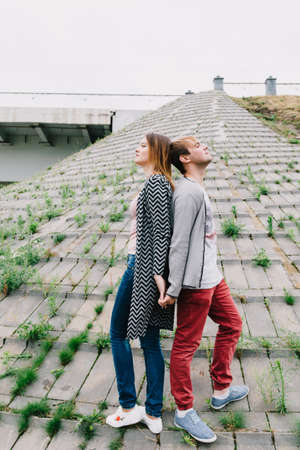 Two lovers walk around the park, kiss and hug, a love story.の写真素材