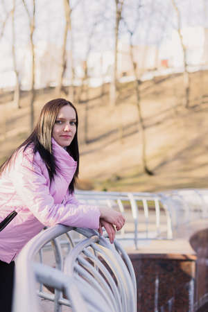 A woman is walking in the parkの写真素材