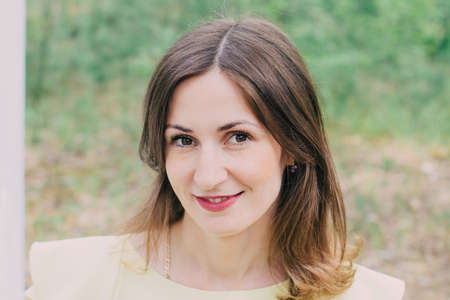 Beautiful woman photographed in nature on a bright day.の写真素材