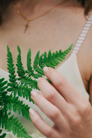 Very beautiful girl photographed in nature with fresh flowers.の写真素材