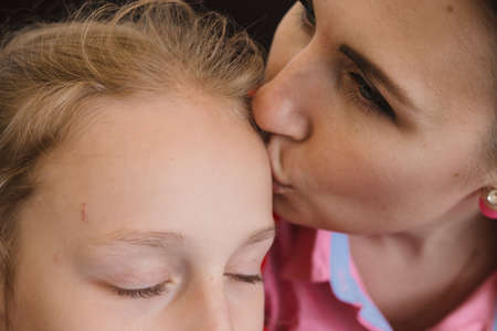 A woman and children in a cafe are waiting for their order