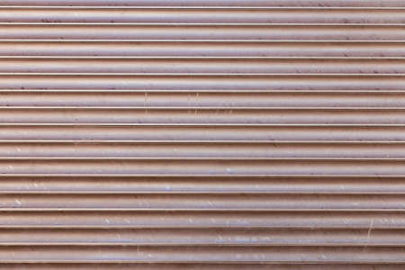 Venetian Jalousie blinds, with warm orange sun flares coming through, soft closeup.の写真素材