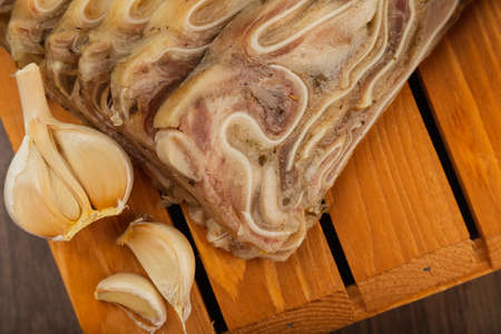 Home-made meat loaf on a wooden surface.