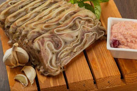 Home-made meat loaf on a wooden surface.