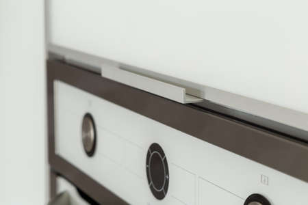 Oven panel close-up, regulators and placard for information