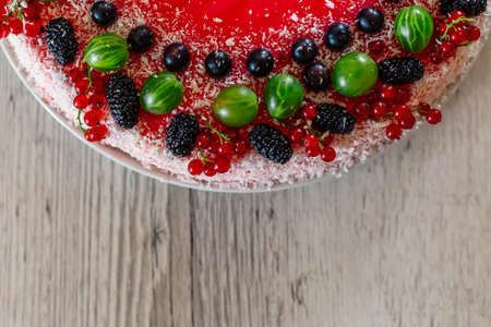 Delicious healthy vegetarian food, do not bake a strawberry cheesecake, decorated with fresh red...