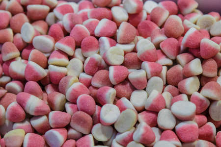 Jelly sweets in large quantities on the counter.