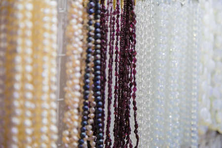 beautiful multicolor beads in necklace form, marvelous colorful beads in necklace form as background, texture.の写真素材