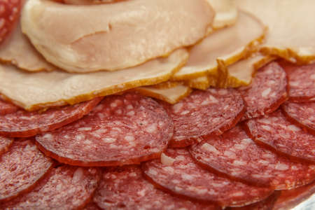 Sausage cuts of different varieties on a plateの写真素材